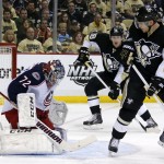 Pittsburgh Penguins' Chris Kunitz (14) watches as a shot by Penguins' Matt Niskanen, not seen, gets past Columbus Blue Jackets goalie Sergei Bobrovsky (72) for a goal in the second period of a first-round NHL playoff hockey game in Pittsburgh Wednesday, April 16, 2014.(AP Photo/Gene J. Puskar)
