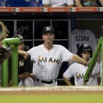 The Miami Marlins new manager Dan Jennings stands in the dugout during the second inning of a baseball game against the Arizona Diamondbacks in Miami, Monday, May 18, 2015. (AP Photo/J Pat Carter)