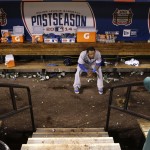 Los Angeles Dodgers shortstop Hanley Ramirez sits in the dugout after his team's 3-2 loss to the St. Louis Cardinals in Game 4 of baseball's NL Division Series Tuesday, Oct. 7, 2014, in St. Louis. (AP Photo/Charles Rex Arbogast)