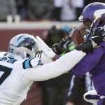 Minnesota Vikings quarterback Teddy Bridgewater, right, is pressured by Carolina Panthers defensive end Mario Addison during the second half of an NFL football game, Sunday, Nov. 30, 2014, in Minneapolis. (AP Photo/Ann Heisenfelt)
