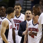 Arizona head coach Sean Miller, third from right, speaks with his team after a scuffle with California in the second half of an NCAA college basketball game in the quarterfinals of the Pac-12 conference tournament Thursday, March 12, 2015, in Las Vegas. Arizona won 73-51. (AP Photo/John Locher)