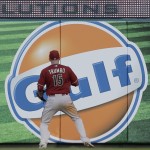 Arizona Diamondbacks right fielder Mark Trumbo watches as a ball hit by St. Louis Cardinals' Kolten Wong bounces off the top of the outfield wall for a solo home run during the first inning of a baseball game Wednesday, May 27, 2015, in St. Louis. (AP Photo/Jeff Roberson)