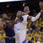 Golden State Warriors forward Marreese Speights (5) shoots against Cleveland Cavaliers forward James Jones (1) during the second half of Game 1 of basketball's NBA Finals in Oakland, Calif., Thursday, June 4, 2015. (AP Photo/Ben Margot)