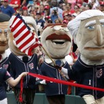 A mascot of President George Washington leads the "Racing Presidents," mascots to the finish line during the fourth inning of a baseball game between the Washington Nationals and the San Francisco Giants at Nationals Park, Saturday, July 4, 2015, in Washington. (AP Photo/Alex Brandon)
