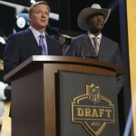 NFL commissioner Roger Goodell introduces former Pittsburgh Steelers cornerback Mel Blount as Blount announces the Steelers select Mississippi defensive back Senquez Golson as the 56th pick in the second round of the 2015 NFL Football Draft, Friday, May 1, 2015, in Chicago. (AP Photo/Charles Rex Arbogast)
