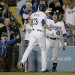  Los Angeles Dodgers' Scott Van Slyke, left, celebrates his home run against the Arizona Diamondbacks with Tim Federowicz during the seventh inning of a baseball game in Los Angeles, Friday, April 18, 2014. (AP Photo/Chris Carlson)