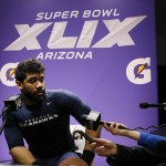 Seattle Seahawks quarterback Russell Wilson (3) speaks during a news conference after the NFL Super Bowl XLIX football game against the New England Patriots Sunday, Feb. 1, 2015, in Glendale, Ariz. The Patriots won 28-24. (AP Photo/Matt York)