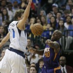 Phoenix Suns forward Anthony Tolliver (40) passes against Dallas Mavericks forward Dirk Nowitzki (41) during the second half of an NBA basketball game Friday, Dec. 5, 2014, in Dallas. The Suns won 118-106. (AP Photo/LM Otero)
