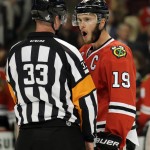 Chicago Blackhawks' Jonathan Toews, right, talks with referee Kevin Pollock after a penalty was called against the Blackhawks during the second period in Game 3 of the NHL hockey Stanley Cup Finalagainst the Tampa Bay Lightning on Monday, June 8, 2015, in Chicago. (AP Photo/Nam Y. Huh)