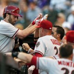  Arizona Diamondbacks' Nick Evans, left, is congratulated after hitting a solo home run by manager Kirk Gibson against the Colorado Rockies in the fourth inning of a baseball game in Denver on Tuesday, June 3, 2014. (AP Photo/David Zalubowski)