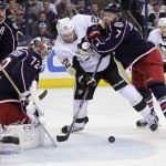 Columbus Blue Jackets' Sergei Bobrovsky (72), of Russia, makes a save as teammate Jack Johnson, right, tries to clear Pittsburgh Penguins' Lee Stempniak from in front of the net during the first period of a first-round NHL playoff hockey game Monday, April 21, 2014, in Columbus, Ohio. (AP Photo/Jay LaPrete)
