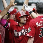  Arizona Diamondbacks' Gerardo Parra, center, celebrates after hitting a two-run home run against the Chicago White Sox during the fifth inning of a baseball game on Sunday, May 11, 2014, in Chicago. (AP Photo/Andrew A. Nelles)