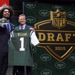 USC defensive lineman Leonard Williams poses for photos with NFL commissioner Roger Goodell after being selected by the New York Jets as the sixth pick in the first round of the 2015 NFL Draft, Thursday, April 30, 2015, in Chicago. (AP Photo/Charles Rex Arbogast)