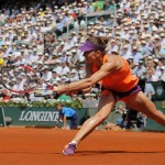 Romania's Simona Halep returns the ball to Russia's Maria Sharapova during their final match of the French Open tennis tournament at the Roland Garros stadium, in Paris, France, Saturday, June 7, 2014. (AP Photo/Michel Spingler)