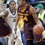 Arizona State guard Jermaine Marshall, right, drives on Oregon guard Joseph Young during the first half of an NCAA college basketball game in Eugene, Ore., Tuesday, March 4, 2014. (AP Photo/Don Ryan)