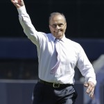 Former New York Yankees manager Joe Torre throws out the ceremonial first pitch at the start of an opening day baseball game between the Yankees and the Toronto Blue Jays in New York, Monday, April 6, 2015. (AP Photo/Kathy Willens)