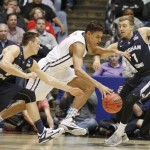 Mississippi's Sebastian Saiz, from Spain, center, drives between Brigham Young's Kyle Collinsworth and Chase Fischer (1) in the first half of a first round NCAA tournament gameTuesday, March 17, 2015 in Dayton, Ohio. (AP Photo/Skip Peterson)