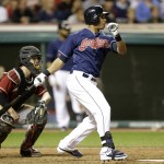  Cleveland Indians' Michael Brantley hits a single in the eighth inning against Arizona Diamondbacks relief pitcher Eury De La Rosa in the second baseball game of a doubleheader, Wednesday, Aug. 13, 2014, in Cleveland. Diamondbacks catcher Tuffy Gosewisch watches (AP Photo/Tony Dejak)