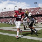 Stanford wide receiver Devon Cajuste, center, makes a touchdown catch past Army defensive back Geoffery Bacon during the second quarter of an NCAA college football game on Saturday, Sept. 13, 2014, in Stanford, Calif. (AP Photo/Marcio Jose Sanchez)
