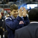Atlanta Hawks' Kyle Korver applauds as he walks off the court after the Hawks beat the Phoenix Suns 96-69 in an NBA basketball game to set a single-season franchise high with their 58th victory Tuesday, April 7, 2015, in Atlanta. (AP Photo/David Goldman)