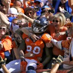 Denver Broncos wide receiver Demaryius Thomas (88) celebrates his touchdown with fans against the Arizona Cardinals during the first half of an NFL football game, Sunday, Oct. 5, 2014, in Denver. (AP Photo/Jack Dempsey)