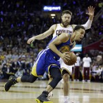 Golden State Warriors guard Stephen Curry (30) drives past Cleveland Cavaliers guard Matthew Dellavedova (8)during the first half of Game 6 of basketball's NBA Finals in Cleveland, Tuesday, June 16, 2015. (AP Photo/Tony Dejak)
