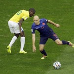 Netherlands' Arjen Robben, right, dribbles past Brazil's Ramires during the World Cup third-place soccer match between Brazil and the Netherlands at the Estadio Nacional in Brasilia, Brazil, Saturday, July 12, 2014. (AP Photo/Themba Hadebe)