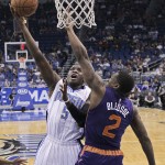 Orlando Magic's Victor Oladipo (5) shoots over Phoenix Suns' Eric Bledsoe (2) during the first half of an NBA basketball game, Wednesday, March 4, 2015, in Orlando, Fla. (AP Photo/John Raoux)