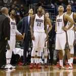 Milwaukee Bucks players and look at the scoreboard against the Chicago Bulls during the second half of Game 6 of an NBA basketball first-round playoff series Thursday, April 30, 2015, in Milwaukee. (AP Photo/Jeffrey Phelps)