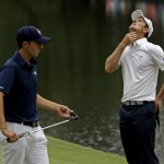 Justin Rose, of England, reacts after missing a putt on the 16th hole during the fourth round of the Masters golf tournament Sunday, April 12, 2015, in Augusta, Ga. Left is Jordan Spieth. (AP Photo/Matt Slocum)