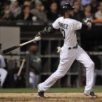  Chicago White Sox's Alexei Ramirez watches his grand slam during the fourth inning of a baseball game against the Arizona Diamondbacks in Chicago, Friday, May 9, 2014. (AP Photo/Paul Beaty)