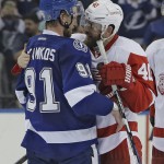 Detroit Red Wings left wing Henrik Zetterberg (40), of Sweden, congratulates Tampa Bay Lightning center Steven Stamkos (91) after the Lightning defeated the Red Wings 2-0 during Game 7 of a first-round NHL Stanley Cup hockey playoff series Wednesday, April 29, 2015, in Tampa, Fla. (AP Photo/Chris O'Meara)