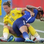 Sweden's Lina Nilsson (16) hauls down United States' Sydney Leroux (2) during second-half FIFA Women's World Cup soccer game action in Winnipeg, Manitoba, Canada, Friday, June 12, 2015.