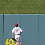 St. Louis Cardinals center fielder Peter Bourjos watches a ball hit for a two-run home run by Arizona Diamondbacks' Mark Trumbo lands over the outfield wall during the eighth inning of a baseball game Monday, May 25, 2015, in St. Louis. (AP Photo/Jeff Roberson)