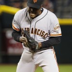 San Francisco Giants' Santiago Casilla celebrates the final out against the Arizona Diamondbacks in the ninth inning of an opening day baseball game Monday, April 6, 2015, in Phoenix. The Giants defeated the Diamondbacks 5-4. (AP Photo/Ross D. Franklin)