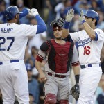  Los Angeles Dodgers' Andre Ethier, right, and Matt Kemp, left, celebrate a three-run home run hit by Ethier in front of Arizona Diamondbacks catcher Miguel Montero during the fourth inning of a baseball game on Saturday, April 19, 2014, in Los Angeles. (AP Photo/Jae C. Hong)