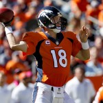 Denver Broncos quarterback Peyton Manning (18) throws against the Arizona Cardinals during the first half of an NFL football game, Sunday, Oct. 5, 2014, in Denver. (AP Photo/Joe Mahoney)