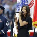Idina Menzel sings the national anthem before the NFL Super Bowl XLIX football game between the Seattle Seahawks and the New England Patriots Sunday, Feb. 1, 2015, in Glendale, Ariz. (AP Photo/Michael Conroy)