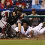 Philadelphia Phillies' Maikel Franco, right, slides safely into home before Arizona Diamondbacks catcher Tuffy Gosewisch, right, can tag him during the fifth inning of a baseball game, Saturday, May 16, 2015, in Philadelphia. (AP Photo/Chris Szagola)