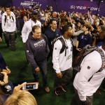 New England Patriots head coach Bill Belichick arrives with his players for media day for NFL Super Bowl XLIX football game Tuesday, Jan. 27, 2015, in Phoenix. (AP Photo/Matt York)
