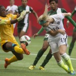 United States' Julie Johnston tries to get a shot past Nigeria goalkeeper Precious Dede during the first half of a FIFA Women's World Cup soccer game Tuesday, June 16, 2105, in Vancouver, British Columbia, Canada. (Darryl Dyck/The Canadian Press via AP)