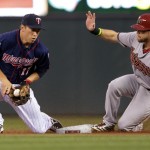  Arizona Diamondbacks' Ender Inciarte, right, steals second on Minnesota Twins second baseman Doug Bernier in the first inning of a baseball game, Monday, Sept. 22, 2014, in Minneapolis. Inciarte's single in the inning extended his hitting streak to 11 games. (AP Photo/Jim Mone)
