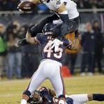 New Orleans Saints tight end Jimmy Graham (80) leaps over Chicago Bears free safety Brock Vereen (45) after receiving a pass from quarterback Drew Brees (9) during the second half of an NFL football game Monday, Dec. 15, 2014, in Chicago. (AP Photo/Charles Rex Arbogast)