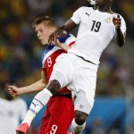 Ghana's Jonathan Mensah, right, goes up over United States' Aron Johannsson to head the ball during the group G World Cup soccer match between Ghana and the United States at the Arena das Dunas in Natal, Brazil, Monday, June 16, 2014. (AP Photo/Julio Cortez)