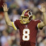 Washington Redskins quarterback Kirk Cousins (8) reacts to wide receiver Andre Roberts' touchdown during the second half of an NFL football game against the Seattle Seahawks in Landover, Md., Monday, Oct. 6, 2014. (AP Photo/Patrick Semansky)