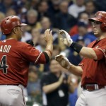 Arizona Diamondbacks' Paul Goldschmidt is congratulated by Martin Prado (14) after Goldschmidt hit a two-run home run during the third inning of a baseball game against the Milwaukee Brewers Wednesday, May 7, 2014, in Milwaukee. (AP Photo/Morry Gash)