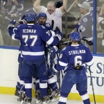 Members of the Tampa Bay Lightning celebrate after center Cedric Paquette's goal during the first period in Game 2 of the NHL hockey Stanley Cup Final against the Chicago Blackhawks on Saturday, June 6, 2015, in Tampa Fla. (AP Photo/John Raoux)