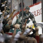 Minnesota Wild left wing Zach Parise reacts in front of the fans after scoring on St. Louis Blues goalie Brian Elliott during the third period of Game 6 of an NHL hockey first-round playoff series in St. Paul, Minn., Sunday, April 26, 2015. The Wild won 4-1 to win the series and advance to the second round. (AP Photo/Ann Heisenfelt)