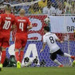  France's Mathieu Valbuena, centre, scores his side's third goal during the group E World Cup soccer match between Switzerland and France at the Arena Fonte Nova in Salvador, Brazil, Friday, June 20, 2014. (AP Photo/Christophe Ena)