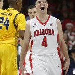 Arizona guard T.J. McConnell (4) celebrates after scoring against California during the second half of an NCAA college basketball game, Thursday, March 5, 2015, in Tucson, Ariz. (AP Photo/Rick Scuteri)